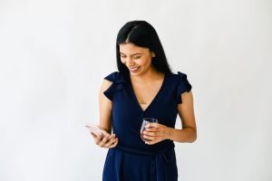 woman looking at her phone